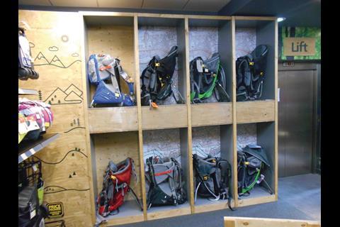 Ultimate Outdoors carves out space for luggage, with rucksacks displayed in raw plywood pigeonholes around the rear perimeter wall.